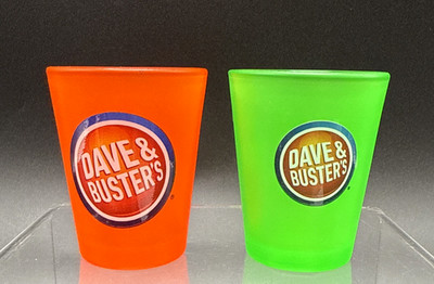 2) Dave & Busters Souvenir Shot Glasses 2.4'' Tall 1- Orange & 1- Green EUC