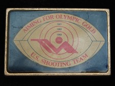 QH01141 VINTAGE 1984 U.S. SHOOTING TEAM AIMING FOR OLYMPIC GOLD BELT BUCKLE