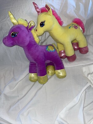 2 MIDWOOD FILLY POP PURPLE AND YELLOW W/PEACE SIGN STUFFED PONY,  YELLOW & PINK