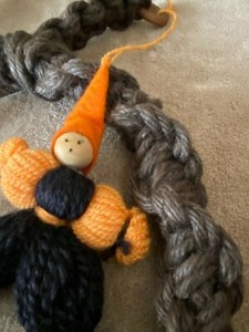 new handmade elf figurine hanging from knotted ring in the middle 16" x 11"