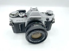 Chrome Canon AE-1 Film Camera + 50mm Lens Manual Focus Camera Kit - Very Good