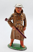 Barclay Manoil Soldier In Trench Coat Holding Riffle Down. Tin Helmet. B50