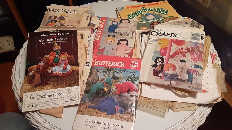 Patterns, Books, and Bits of Fabric for Making Dolls