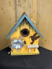Yellow Birdhouse With Metal Flower and BIrd