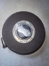 VINTAGE LUFKIN RULE CO. 50 FT. METALLIC TAPE MEASURE W/ BROWN LEATHER HOUSING