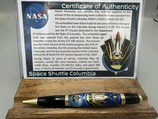 Columbia Space Shuttle Pen with 2 pieces of the Shuttle imbedded in the pen.