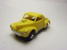 T-JET MODEL MOTORING YELLOW WILLYS SLOT CAR BODY. NEW
