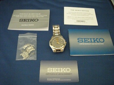 Men's Seiko V157-0AK0 Solar Watch Roman Numeral XII on Gray Face Two Tone Band