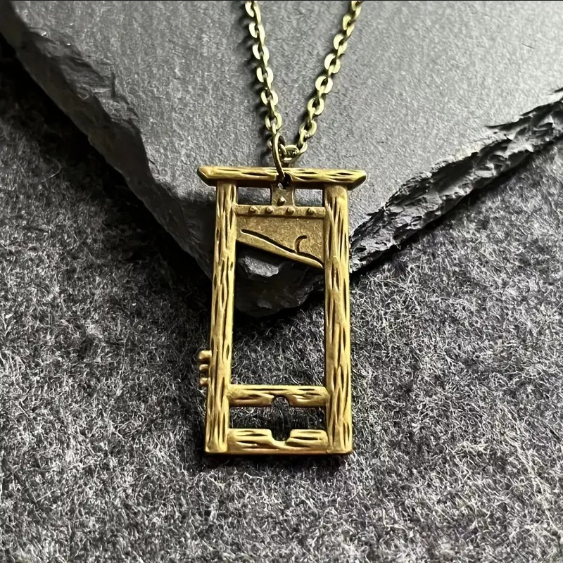 A miniature guillotine pendant that actually mimics the blade drop — morbidly fascinating medieval jewelry that sparks instant conversation.