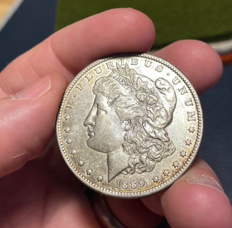 (#101777) Morgan Dollar: 1889 O AU prob lightly cleaned, luster tho (see video!)
