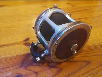 PENN SENATOR 114H 6/0 with sliver TIBURON frame & clamp with