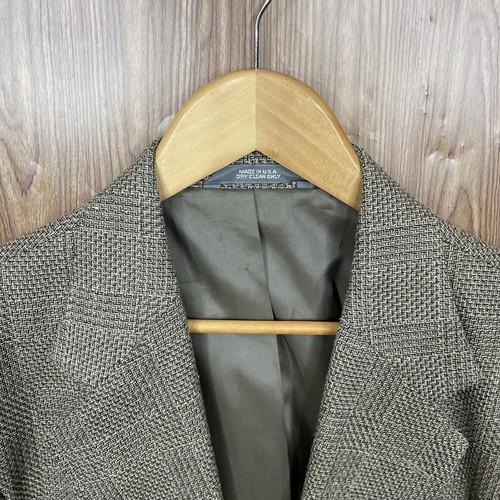 Haggar men's 42L green, black, and beige plaid coat with notch lapels, two buttons, and "Made in U.S.A." label.