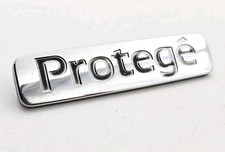 1995-1998 MAZDA PROTEGE REAR LID CHROME EMBLEM LOGO BADGE SIGN SYMBOL LETTERS