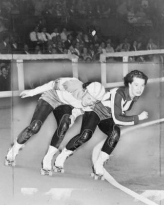 8'' x 10'' Photo 1950 Swinging down the track . Two women compete in roller