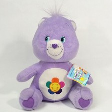 Care Bears Harmony Lavender Plush 12" Stuffed Animal sits Tags written on 2004