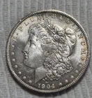 1904 O Morgan Silver Dollar. Estimated Almost Uncirculated 58 Toner. M0124.