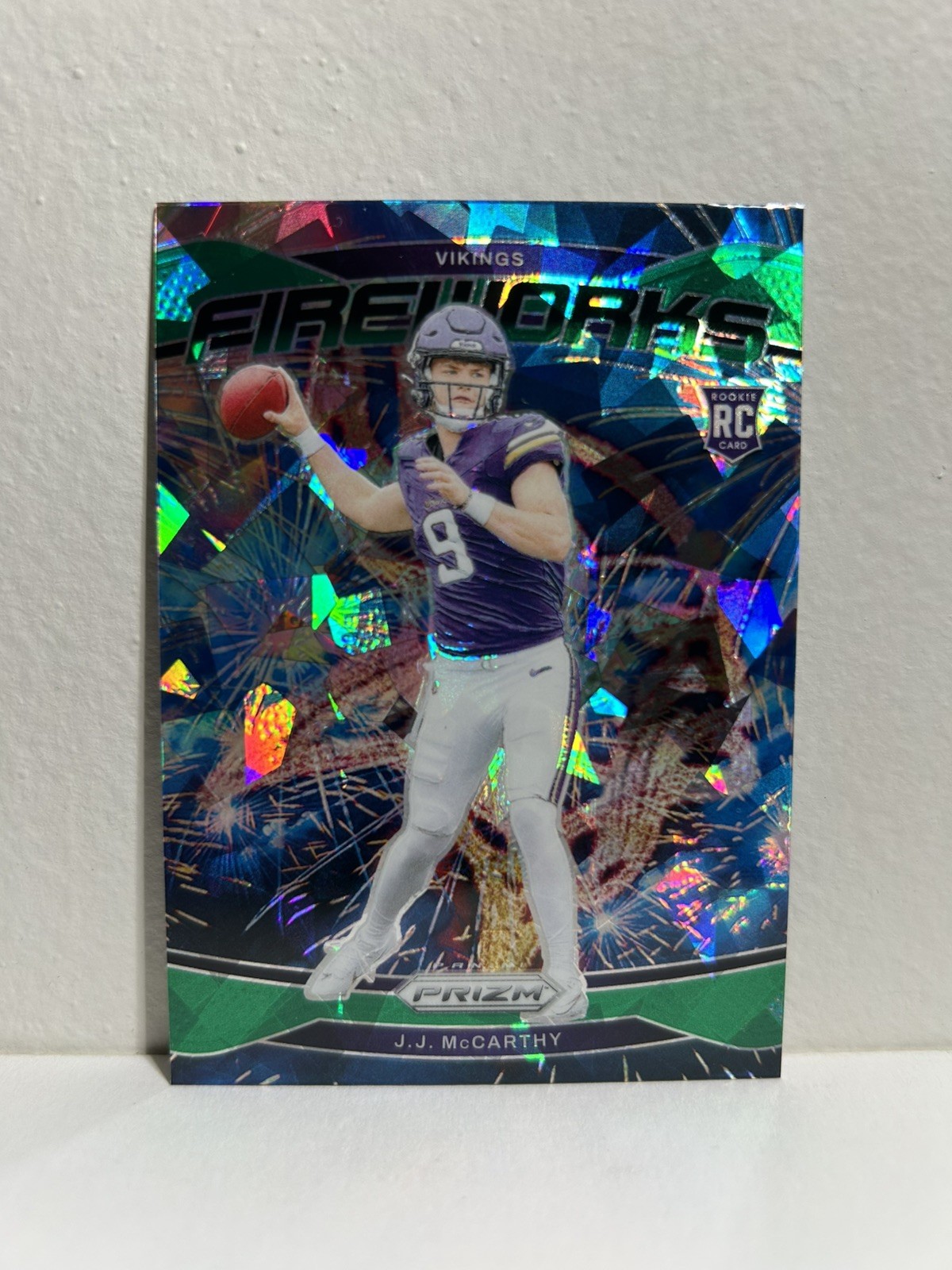 2024 Prizm #18 J.J. McCarthy Fireworks Green Cracked Ice Rookie RC - Vikings