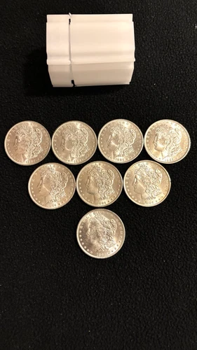 1884-O MORGAN SILVER DOLLARS BU/UNC. BLAST WHITE LOT OF 8 WITH PLASTIC TUBE