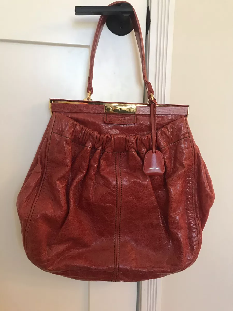 Bolso top reebok dorados
