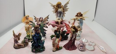 A Collection Of 8 Different  Faries With The Glass You See