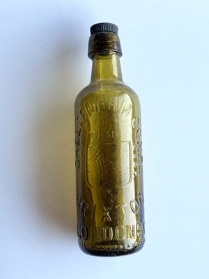 Antique Cheltenham Co Brixton London Green Glass Bottle Embossed Shield c. 1895
