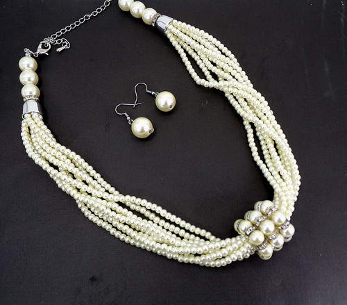 Multi strand pearl necklace and 