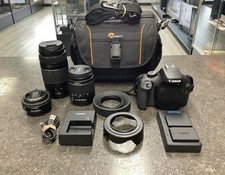 CANON EOS REBEL T100 18MP DSLR CAMERA W/3-LENS QCP004790 