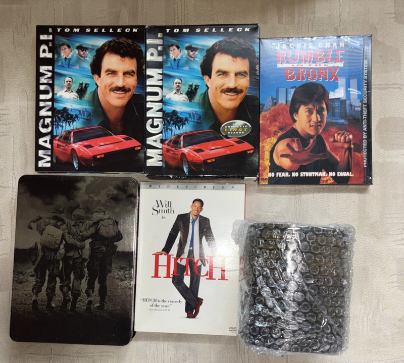 LOT OF 100 DVDS IN removed from containers