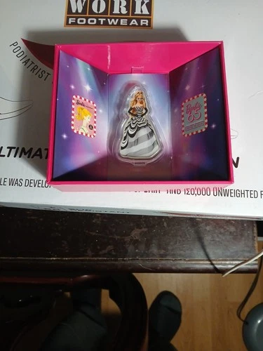 New ListingBarbie Signature 65th Anniversary Blue Sapphire Doll 1 Oz 999.9 Fine Silver