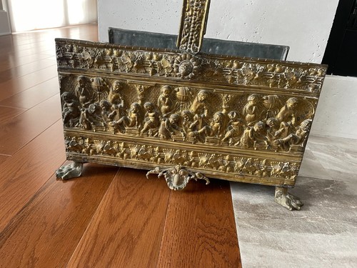 Early antique brass ornate claw foot hand hammered log holder.