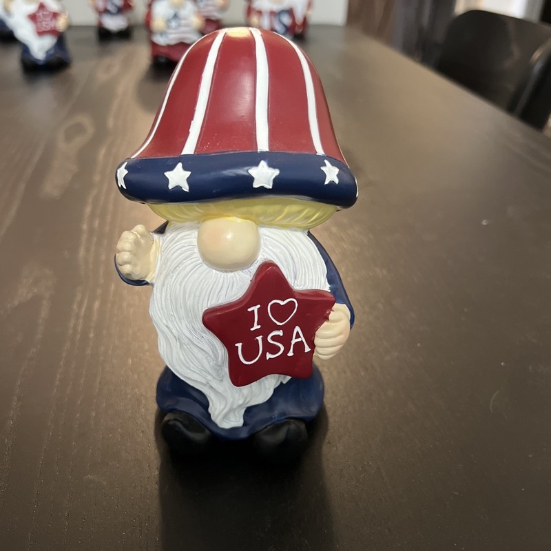 A Garden Gnome Patriotic Themed American Flag Garden Statue