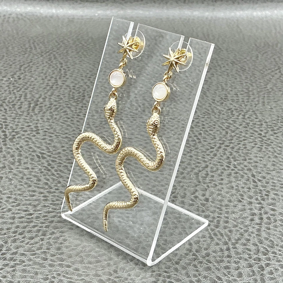 Pendientes colgantes de serpiente tono dorado llamativos perforados Starburst cabujón blanco Foto 2 de 4