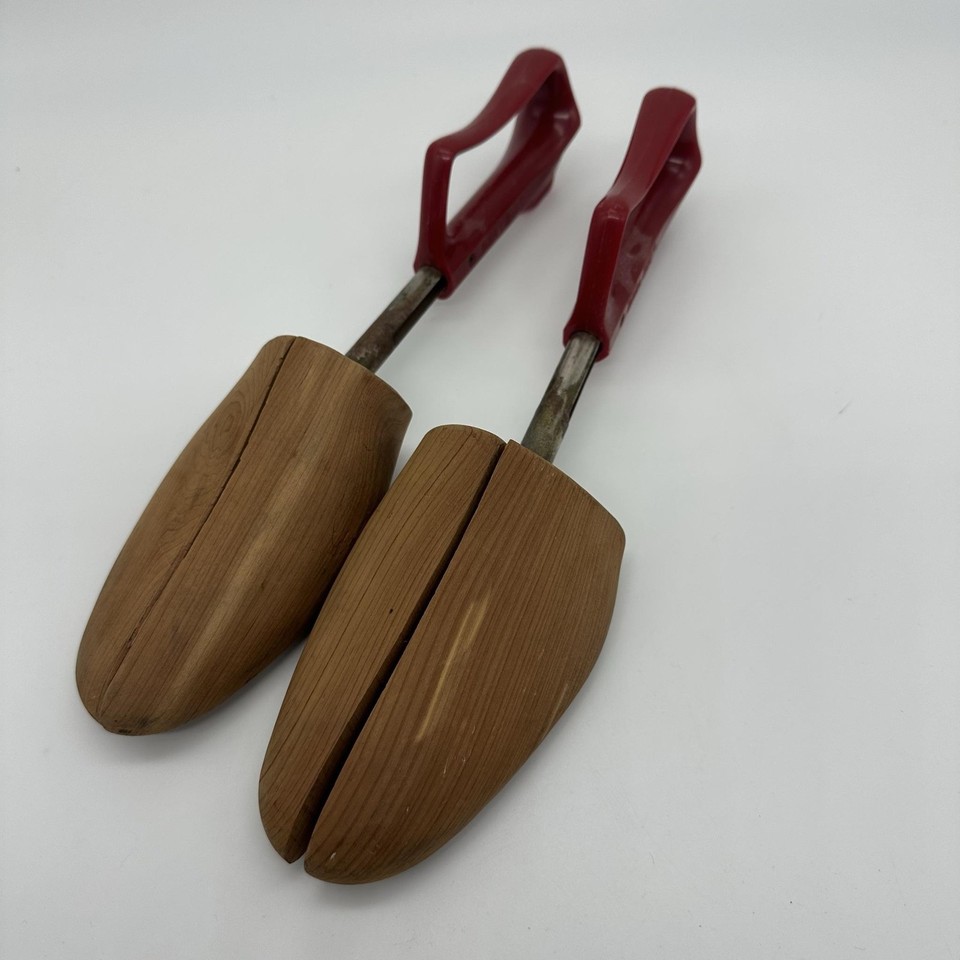Proper vintage wooden shoe trees with red handles — the kind of classic men's accessory that's been replaced by cheap plastic and deserves a comeback.