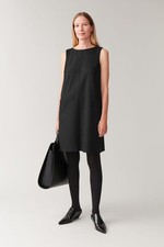 COS Kleid Wolle Jersey S schwarz aufgesetzte Taschen raw edges