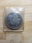 1884 $1 Morgan Silver Dollar in plastic sleeve — photo 1