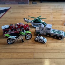 Lot of Hess truck helicopter fire engine and random motorcycle & Volkswagon bug