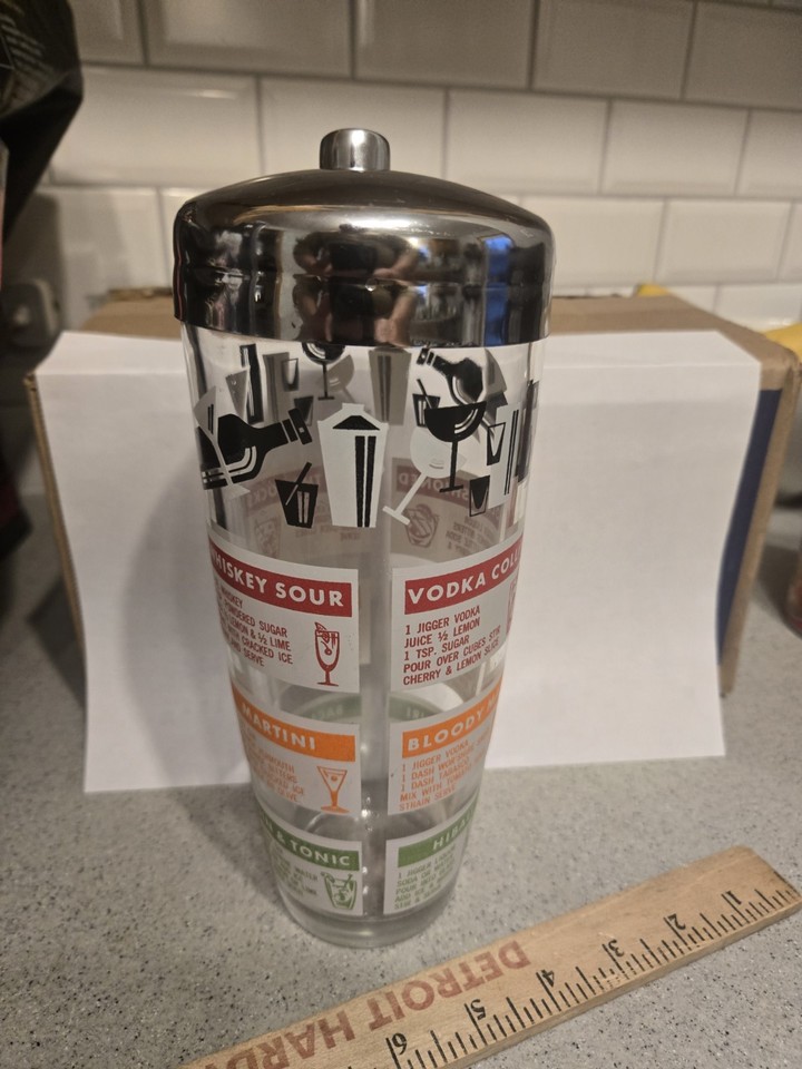 A Hazel-Atlas cocktail shaker with 12 printed recipes built right in is a functional time capsule from 1950s cocktail culture — barware and bartending guide in one.