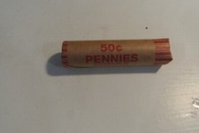 Indian Head Penny Showing On End Of 50 Coin Lincoln Wheat Roll