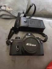Nikon EM 35mm Film Camera W/ Strap and Flash. Tested, and in MINT Condition 