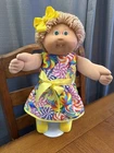 New Listing1980s Cabbage Patch Kid Blonde Hair Green Eyes One Tooth Candy Swirl Dress
