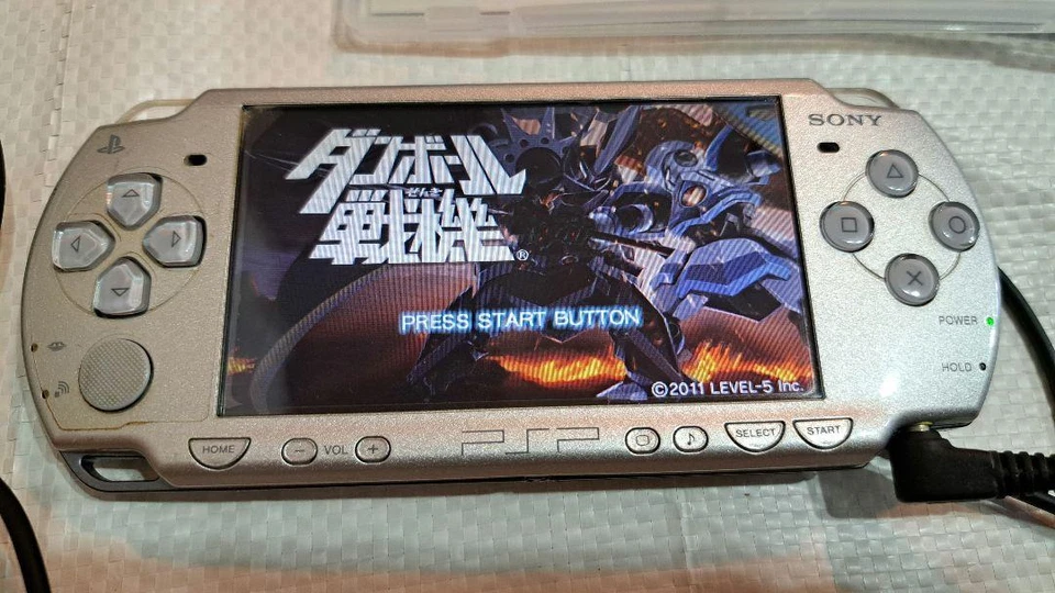 PSP-2000 Ice Silver console, working condition, includes AC adapter and 10 games - Image 2 of 4