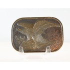 Flying Eagle silver belt buckle with gold overtones, bronze eagle design, and laurel wreath on textured metal plate.