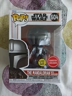 FUNKO POP! STAR WARS THE MANDALORIAN WITH DARKSABER 604 GITD GLOWS DARK GAMESTOP