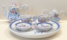 9 PIECE MINIATURE TEA SET WHITE EMBELLISHED IN GOLD WITH FLOWERS PERFECT COND.