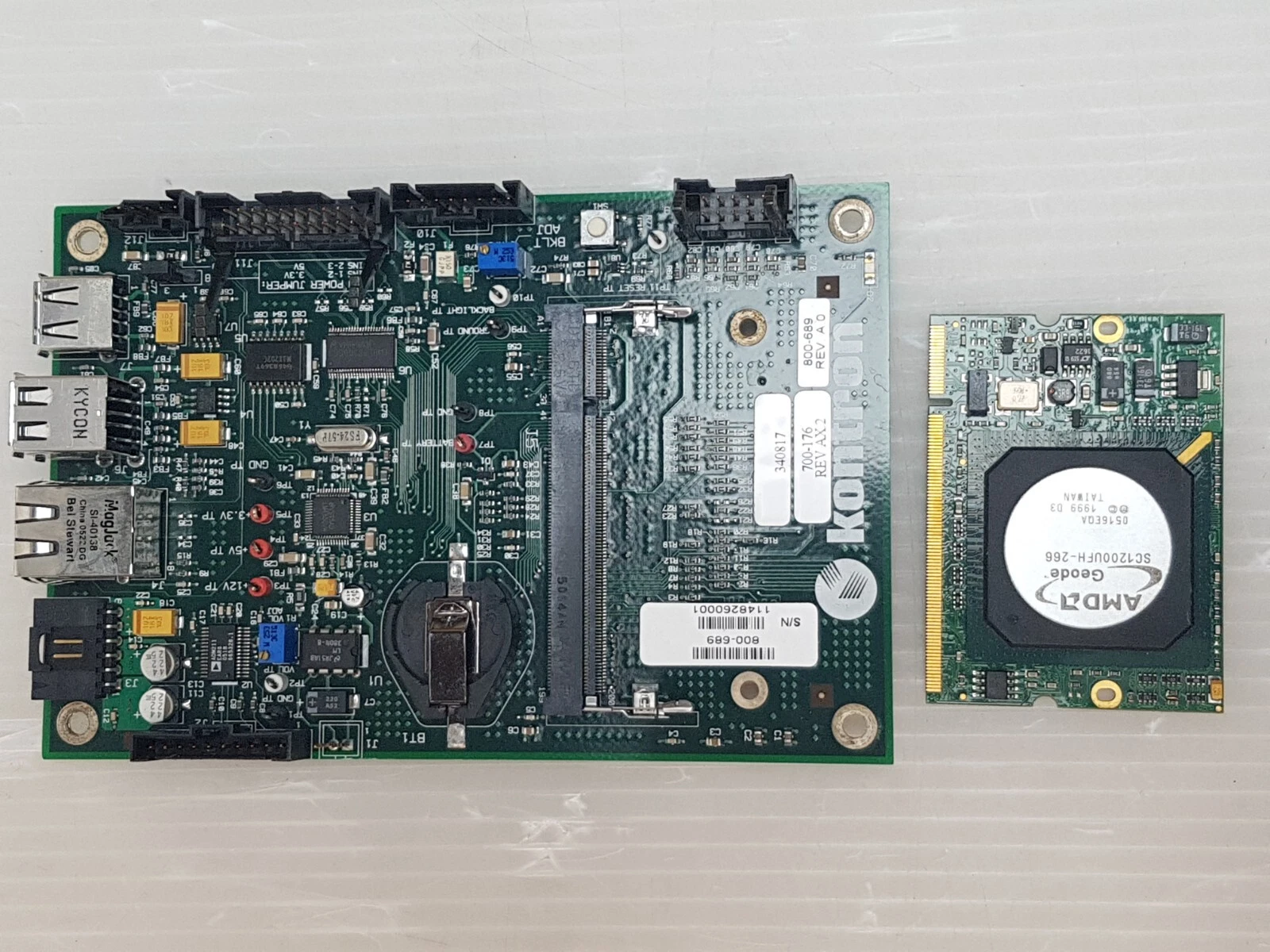 Kontron board beside its removed AMD Geode SC1200UFH-266 processor module
