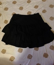 Black mini skirt with ruffles and elastic waistband size small