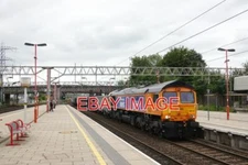 PHOTO  CLASS 66 66731  PASSES STAFFORD STATION WORKING 4H61 SMALL HEATH LAFARGE
