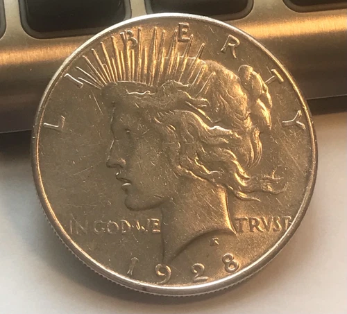 1928-s Peace  silver dollar , brilliant AU  , scarce