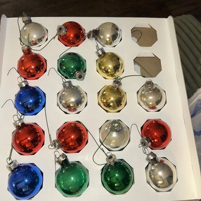 Vintage Fm Rauch glass Christmas ornaments in assorted colors.