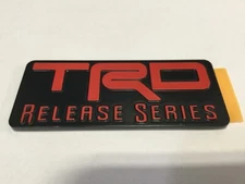 Genuine Toyota/Scion Black & Red TRD Release Series Emblem/Badge PTR26-21090